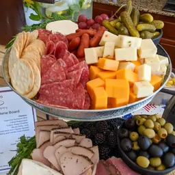 Charcuterie Board with Meats, Cheeses, Olives, and Crackers