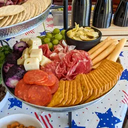 Charcuterie Board with Meats, Cheeses, Olives, and Crackers
