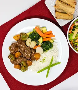 Pineapple teriyaki beef, vegetables, and egg rolls catered in Murrieta