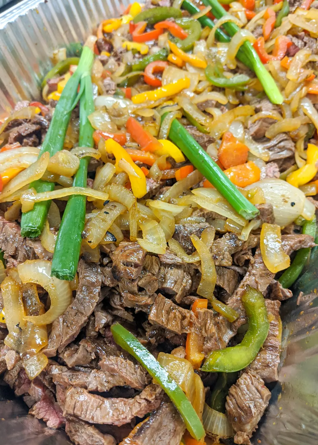 Steak fajitas with onions and peppers
